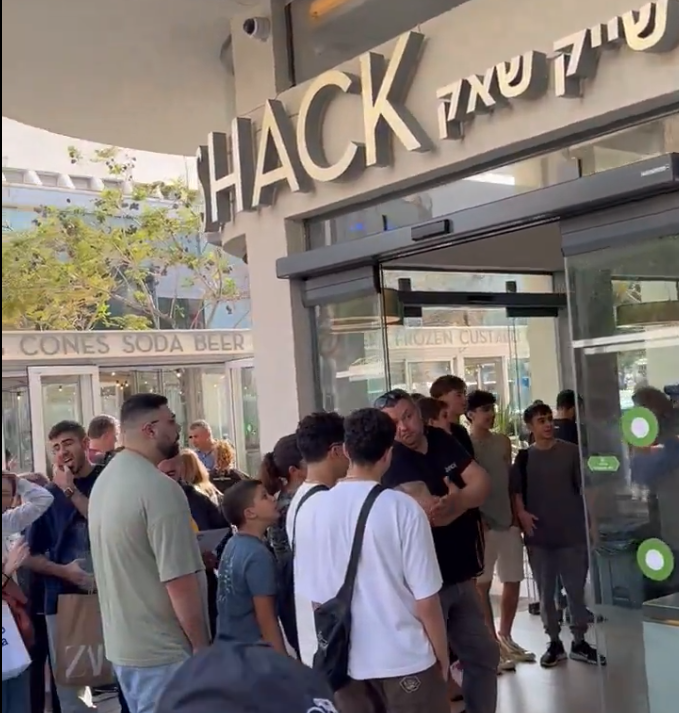Hamburger-hungry Israelis line up on Feb. 27, 2024 at Shake Shack in Tel Aviv, marking the U.S. chain's launch in the country.