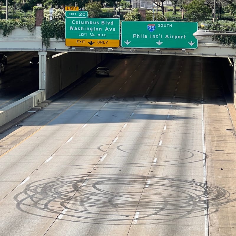 Circles of tire tracks are all that remained of a deadly shooting incident on Sunday morning, shortly before the southbound lanes of I-95 reopened.