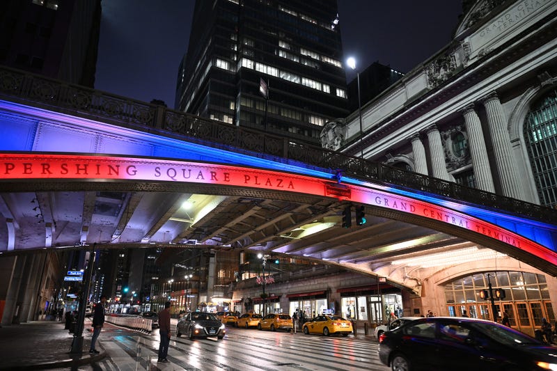 The Pershing Square/Grand Central Terminal viaduct is lit in red, white, and blue light on a past Memorial Day