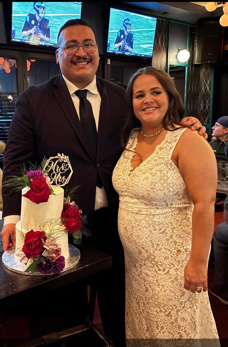 Man with woman in wedding dress