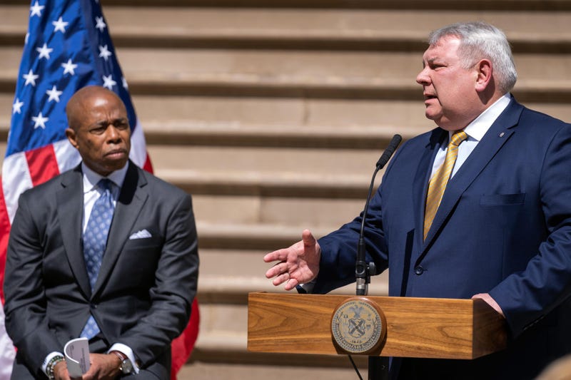 Adams watches Consul General Holubov speak at the press conference where he announced the allocation of $2 million to house and support Ukrainian refugees in New York City.