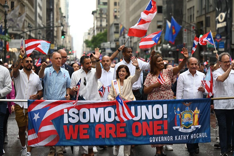 Governor Kathy Hochul, joined by First Gentleman Bill Hochul, Lieutenant Governor Antonio Delgado, Secretary of State Robert J. Rodriguez, Attorney General Tish James, and other elected officials, marches in the 65th Puerto Rican Day Parade in New York City, Sunday June 12, 2022. 