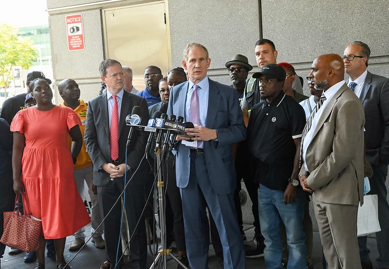MTA Chair and CEO Janno Lieber, NYC Transit President Richard Davey, Senior Advisor Shanifah Rieara, TWU President Tony Utano, TWU VP Robert Kelley, and NYC Transit Cleaner Anthony Nelson and family at news conference following the court proceeding that included the unsealing of an indictment charging Alexander Wright with assault.