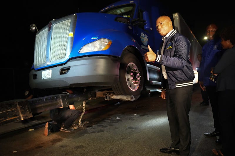 Mayor Eric Adams reacts as a truck is towed near Springfield and Merrick boulevards in Laurelton on Monday night