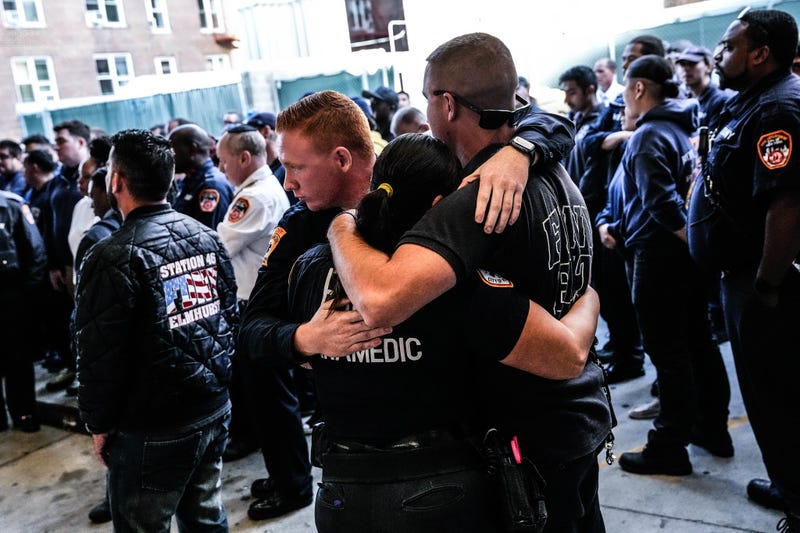 Members of the FDNY outside Mount Sinai Queens on Thursday as Mayor Eric Adams arrived