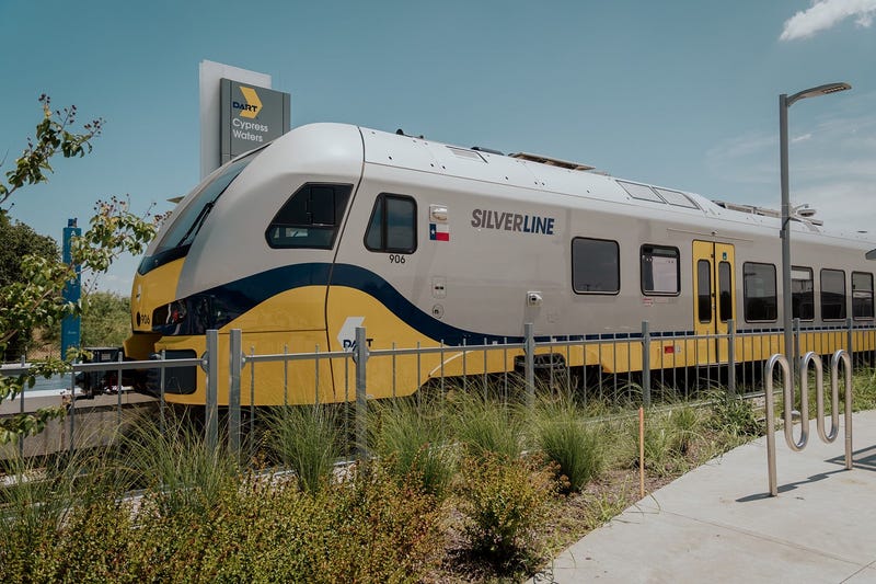 Dallas Area Rapid Transit’s new Silver Line is a 26‑mile commuter rail project - not just another light rail line. Stretching from Plano to DFW Airport and covering seven North Texas cities (Grapevine, Coppell, Dallas, Carrollton, Addison, Richardson, and Plano), it's designed for longer-distance, suburban travel with fewer stops, higher speeds, and diesel-powered diesel multiple unit (DMU) trains.