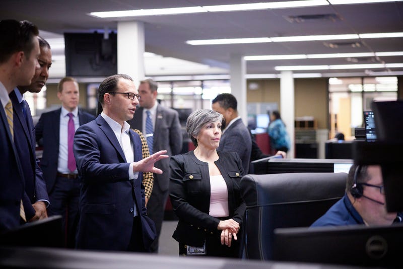 Governor Josh Shapiro observes 911 operators at the Montgomery County 9-1-1 Center with Deputy Director of Emergency Communications for Montgomery County Jennifer Cas.