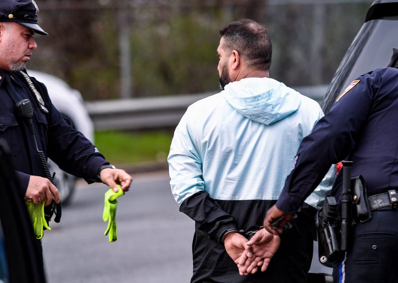 A man is taken into custody at the Verrazzano-Narrows Bridge on April 11, 2023