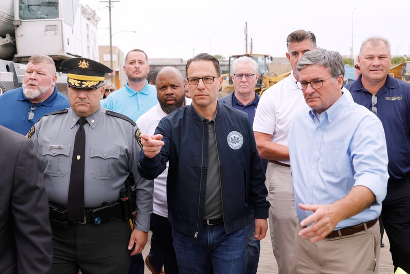 Gov. Josh Shapiro (center) and Pennsylvania Secretary of Transportation Mike Carroll (right) joined other officials on June 14 to announce the development of a plan to safely and quickly reopen I-95 after a section of it collapsed days earlier. 