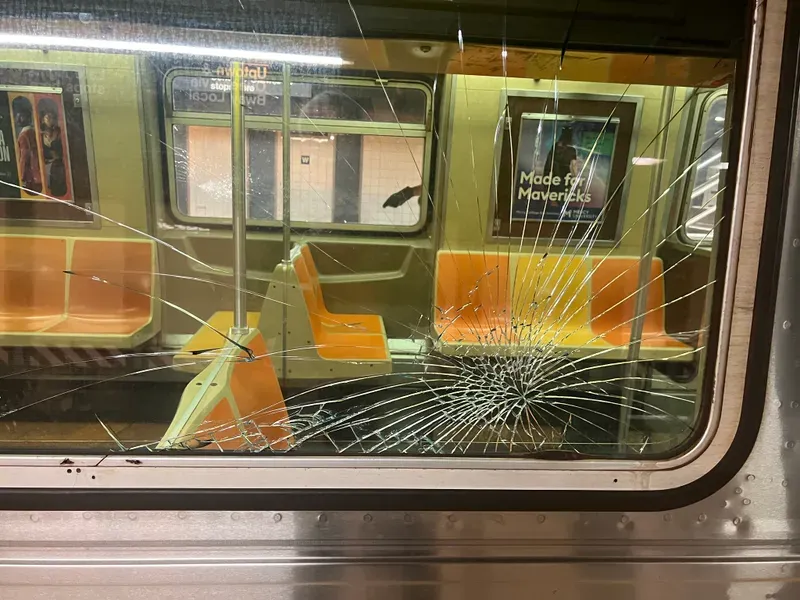 Train car after train car had its windows smashed. 