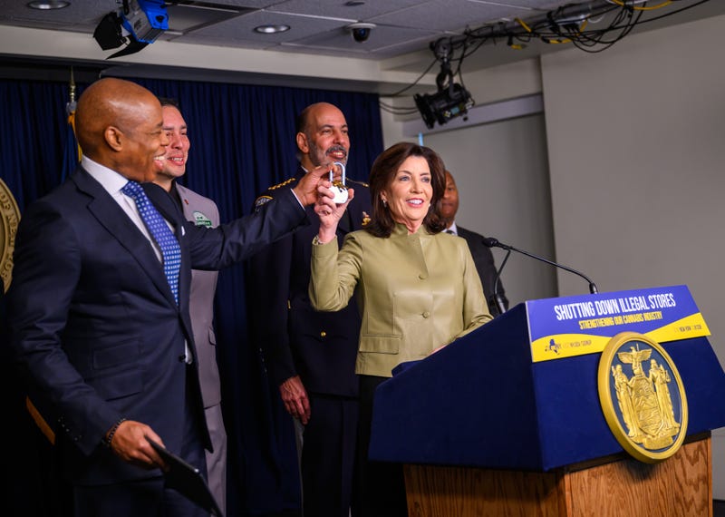 Gov. Kathy Hochul and Mayor Eric Adams unveiled the measures Friday at the governor's Manhattan office, holding up a padlock like the ones that can be used to shut down illicit shops