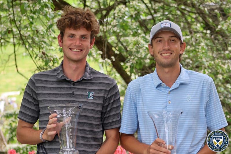 young golfers with a trophy