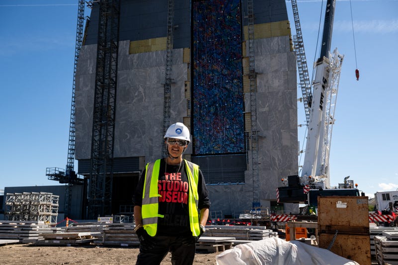 Artist Julie Mehretu tours the Obama Presidential Center site during the installation of her commissioned artwork, an 83-foot-tall painted glass window titled "Uprising of the Sun."