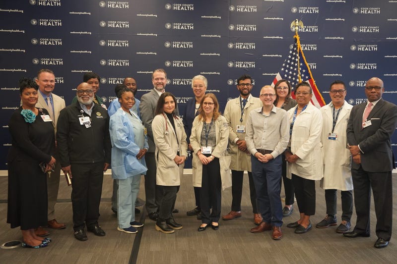 Cook County Health doctors surrounding Toni Preckwinkle
