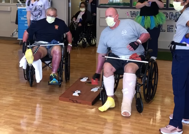 Two injured Dallas firefighters recuperate with a friendly game of cornhole