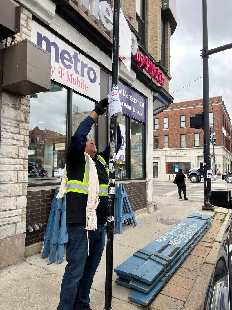 A city worker prepares for Saturday's Mexican Independence parade in Pilsen.