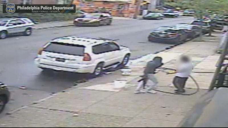 Video surveillance captures Jovaun Patterson approaching Li "Mike" Poeng with an AK-47 at 54th and Spruce streets, May 8, 2018.