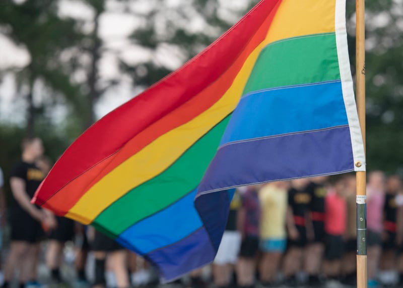 A rainbow flag waves at the starting line of a Pride Observance Month 5K run at Joint Base Langley-Eustis, Virginia, June 21, 2019.