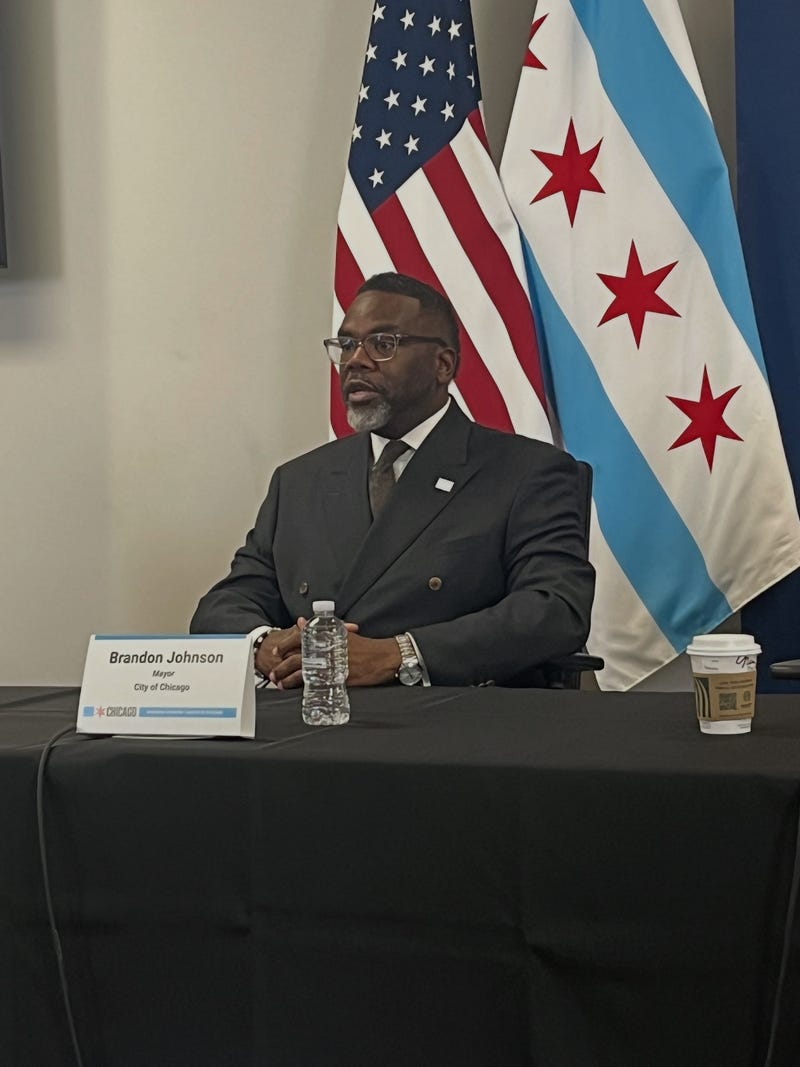 Chicago mayor Brandon Johnson talks to reporters at City Hall, October 28, 2025
