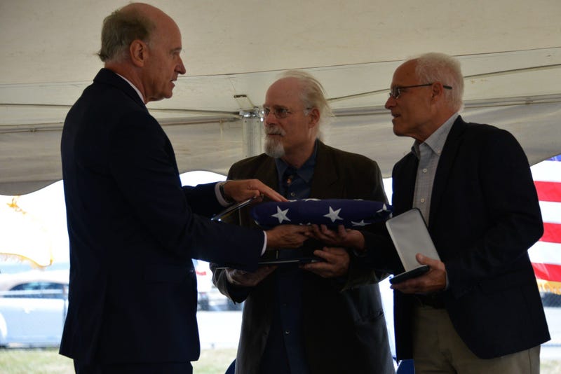 Massachusetts U.S. Representative Bill Keating presented Stephen and Bradley Finch with an American flag