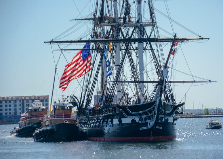 USS Constitution is tugged out to Fort Independence on Castle Island during ‘Old Ironsides' Chief Petty Officer Heritage Week underway.