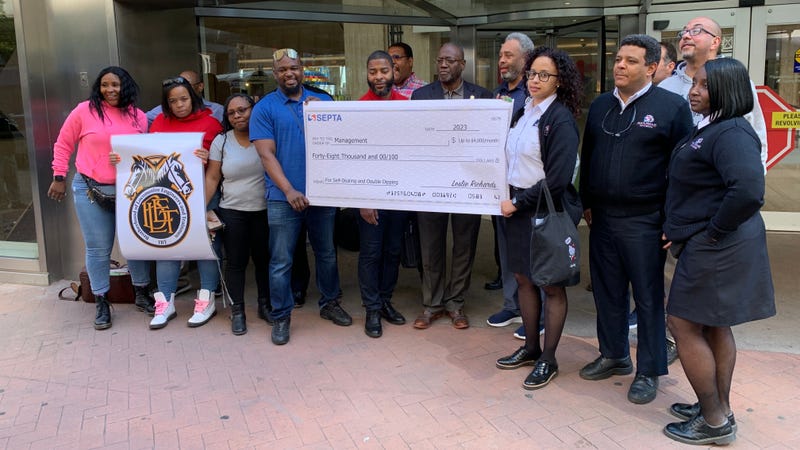 Members of the Brotherhood of Locomotive Engineers and Trainmen demonstrated outside SEPTA headquarters Wednesday, holding an oversized bank check.