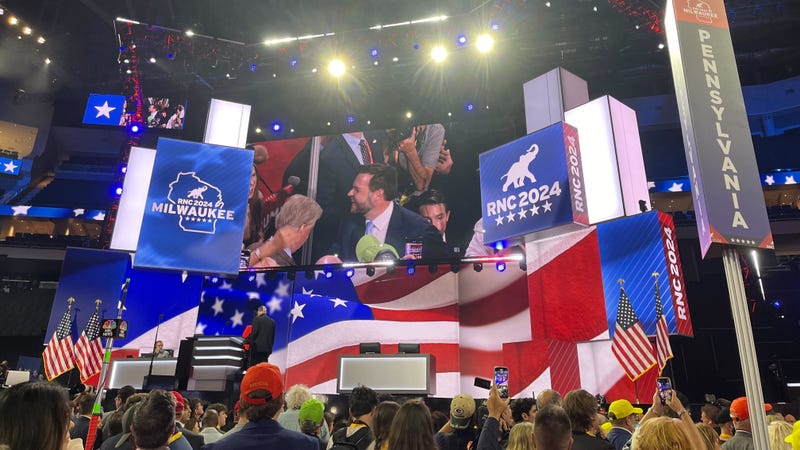 GOP vice presidential nominee JD Vance is seen on the big screen working the floor of the Republican National Convention in Milwaukee.