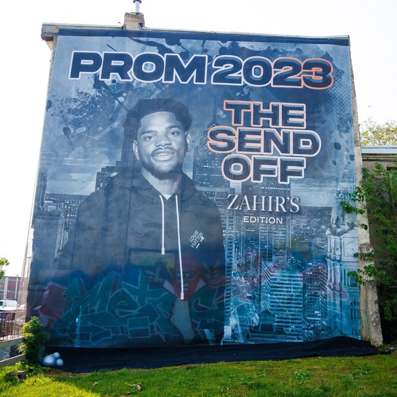 A giant mural-style banner with Zahir Harris’ picture and the words “PROM 2023, THE SEND OFF, ZAHIR’S EDITION” was unfurled against the side of a row home in West Philly.