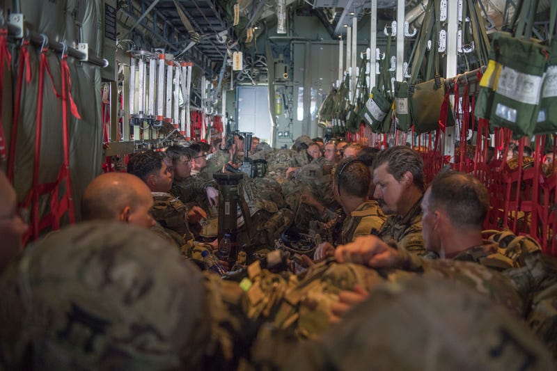 U.S. Army Soldiers, assigned to the East Africa Response Force (EARF), 101st Airborne Division, sit aboard a C-130J Super Hercules, assigned to the 75th Expeditionary Airlift Squadron, waiting to takeoff at Camp Lemonnier, Djibouti