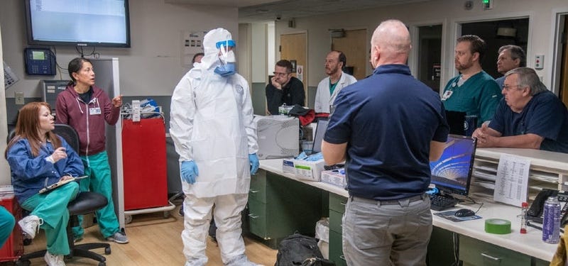 Members of the West Virginia National Guard train hospital staff prepare the hospital for possible future cases of COVID-19/SARS-CoV-2.