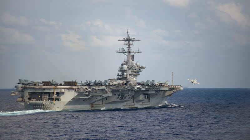  An F/A-18F Super Hornet, assigned to the “Black Knights” of Strike Fighter Squadron (VFA) 154, launches from the flight deck of the aircraft carrier USS Theodore Roosevelt (CVN 71)