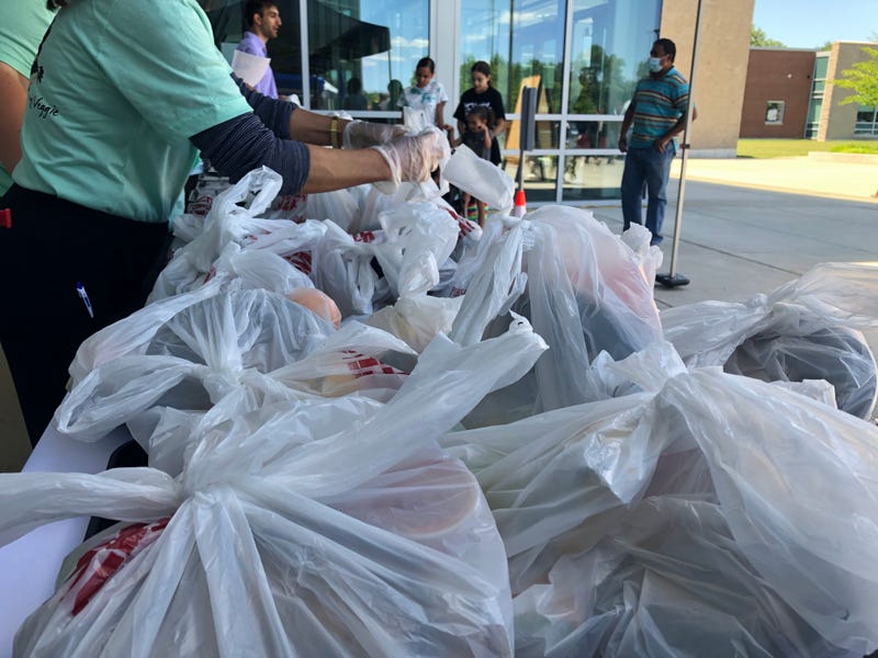 Families collecting meals at Maloney High School in Meriden.