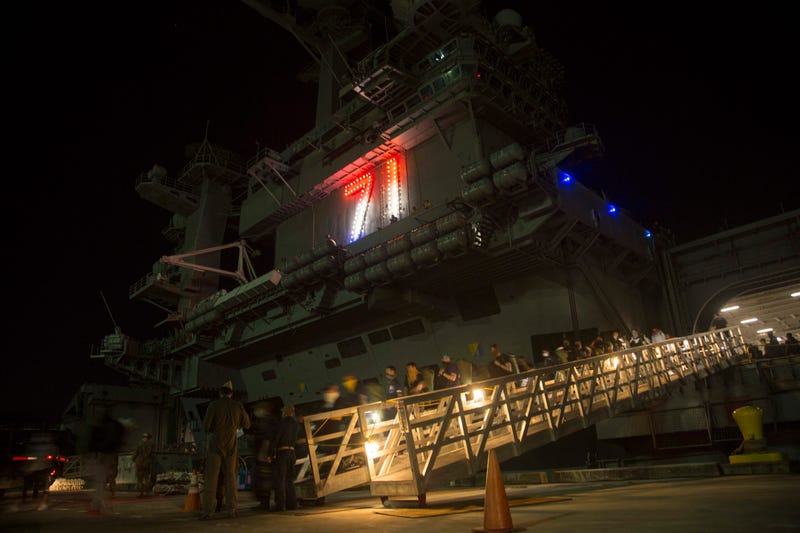 USS Theodore Roosevelt Sailors Evacuate