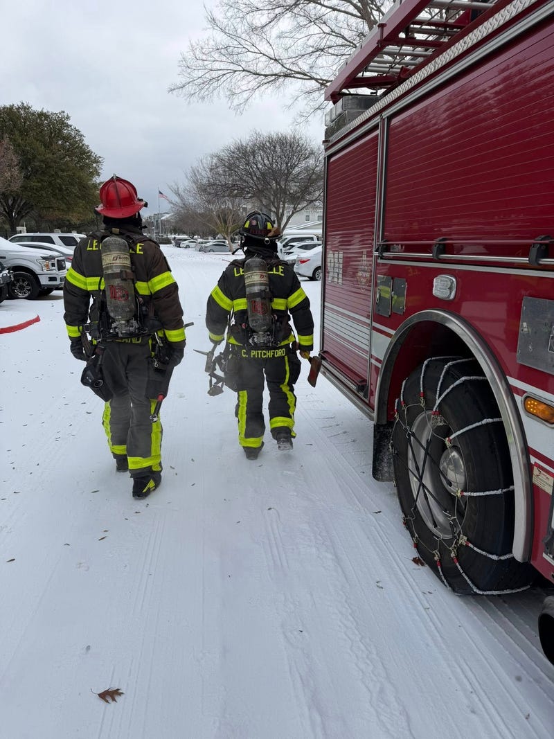 Lewisville firefighters pulled a woman and another person from an icy retention pond Sunday afternoon after the woman fell through thin ice while attempting to rescue her dog, authorities confirmed. 