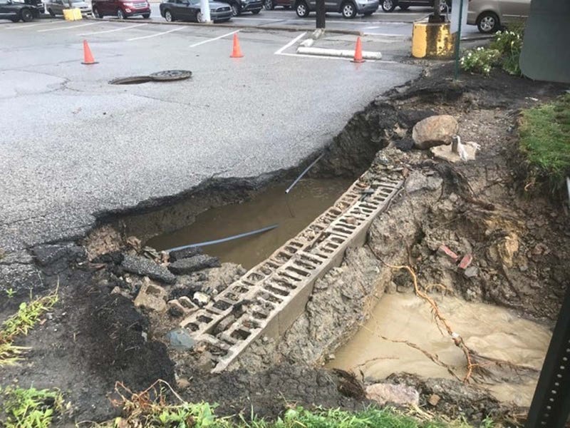 Heavy Rains Cause Sinkhole To Open Along McKnight Road