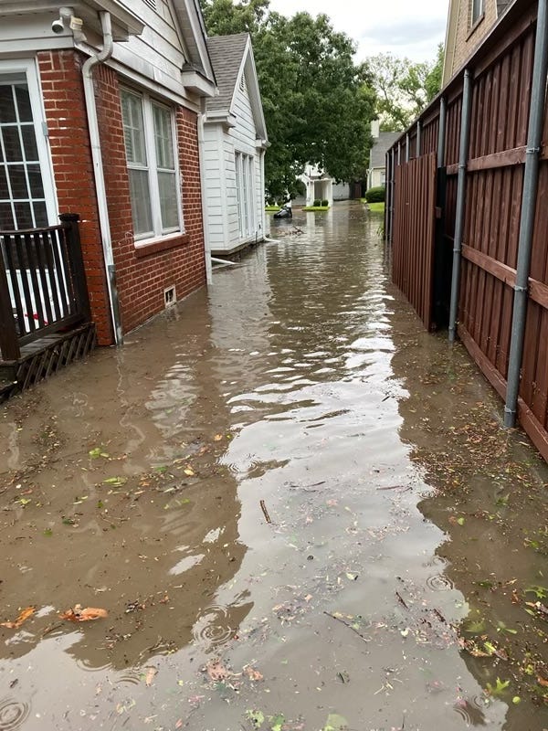 flooding between homes in Dallas County