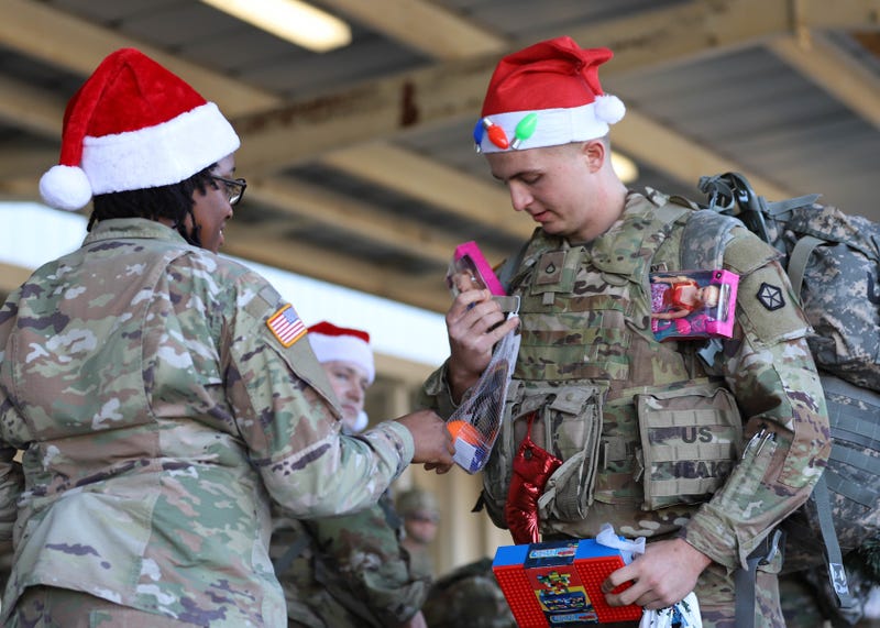 Victory Corps soldiers march to deliver Christmas cheer