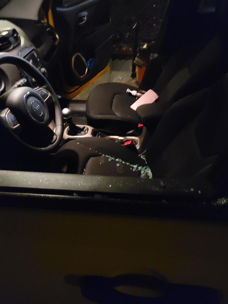 Board of Trustees Vice President Mike Baker's vehicle with a smashed window.