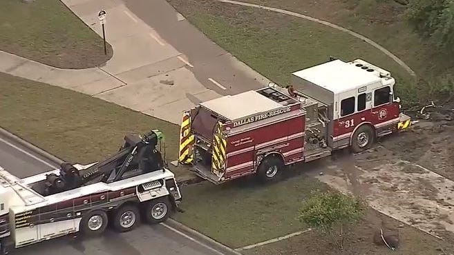 Dallas fire truck hydroplanes and crashes into car, one person injured