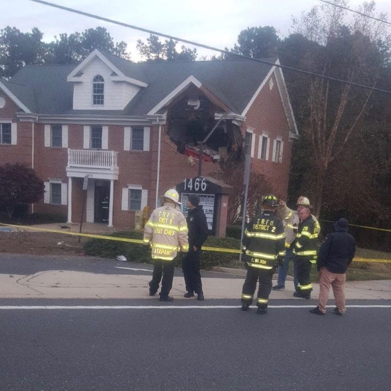 Porsche crashes into NJ office building