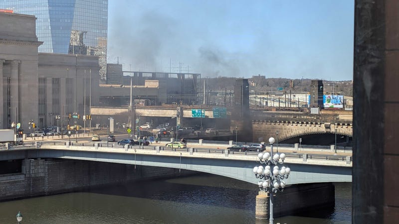 Black smoke billows from underneath Schuylkill Avenue Thursday afternoon.