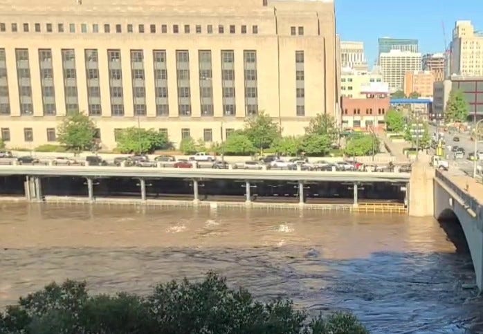 The Schuylkill River flooding its banks, as seen from KYW Newsradio.