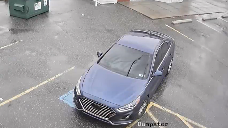 Investigators found this blue Hyundai, seen in surveillance video moments before the attack, later Wednesday night.