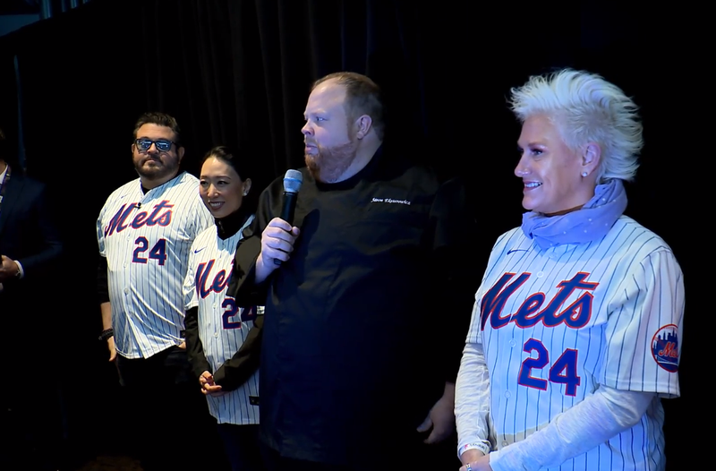 Citi Field's newest celeb chef partners (from left, in Mets jerseys), Adam Richman, Judy Soo and Anne Burrell, join Chef Jason Eksterowicz, Aramark senior executive chef for Citi Field on March 21, 2024 at Citi Field.