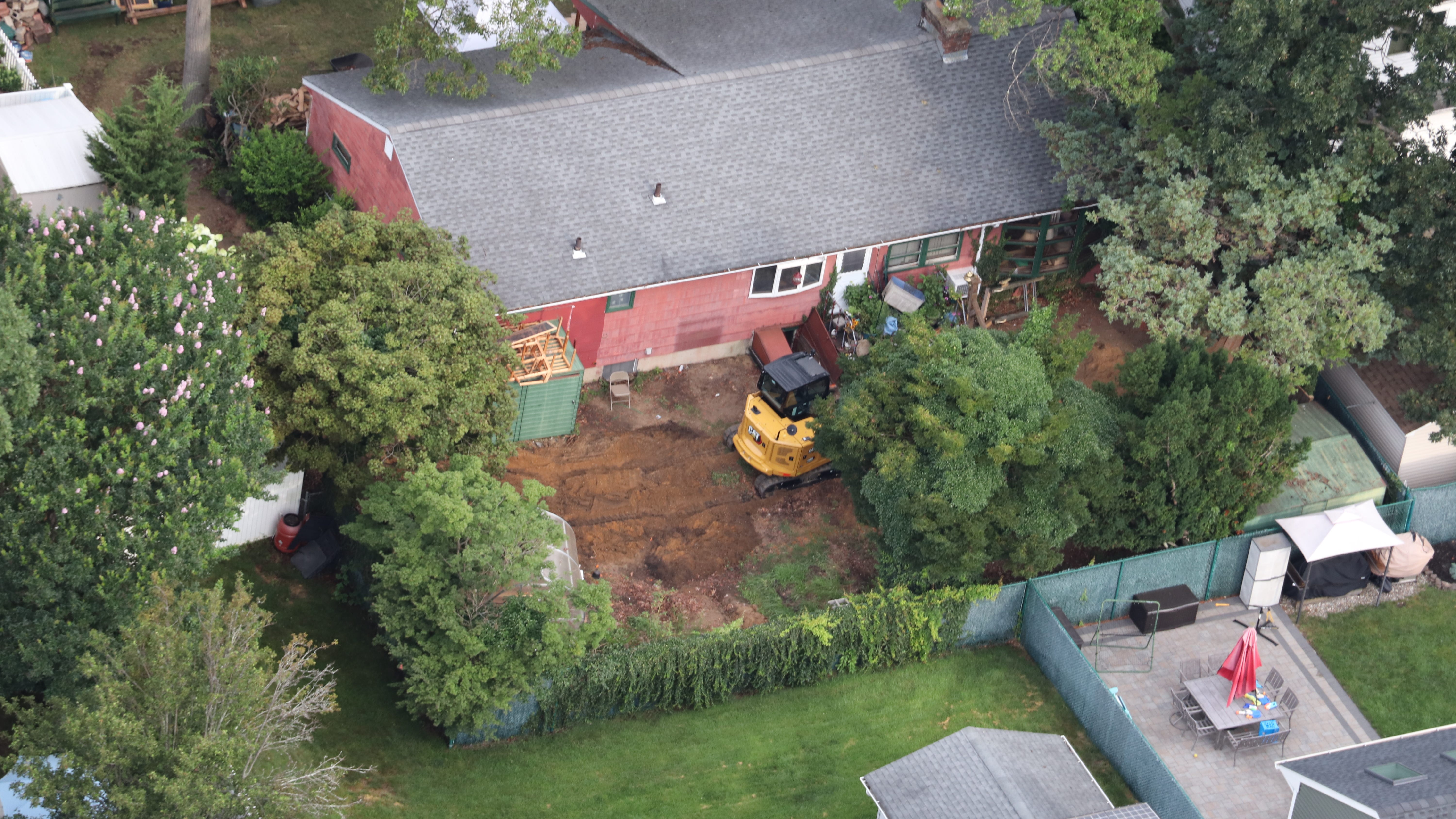 AERIAL PHOTOS: Excavator digs up backyard of Gilgo Beach murders suspect Rex Heuermann