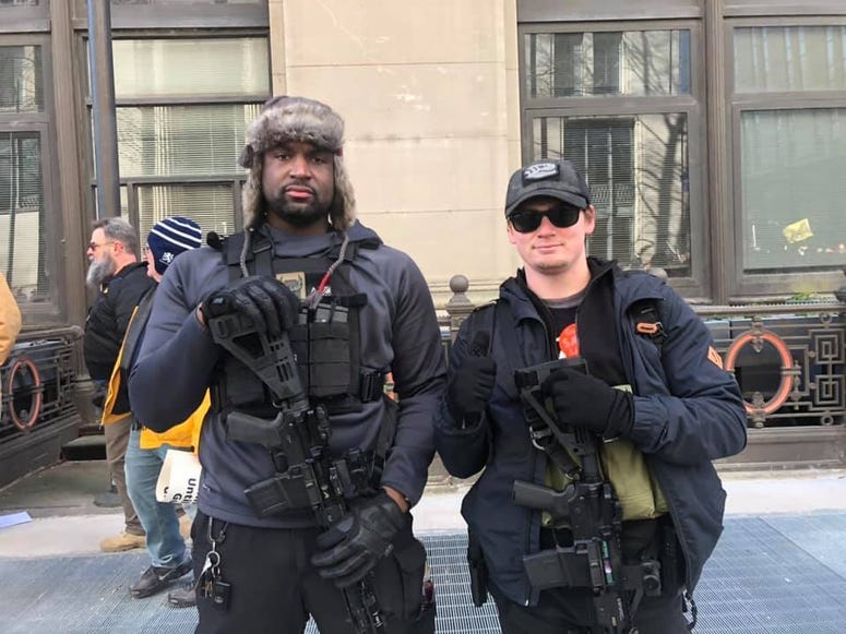 Tayji Tucker of Richmond and Robert Dean of Harrisonburg show off their weapons during the Gun Rights Rally on Janaury 20,2020. (Matt Demlein, WRVA)