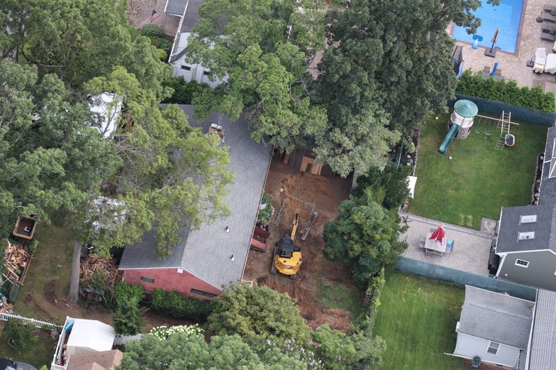 The backyard seemed to be almost entirely dug up Monday