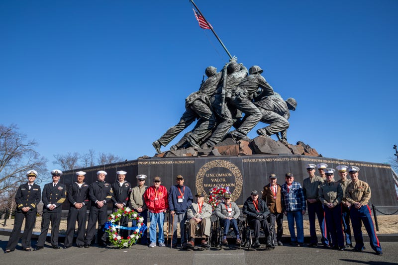 Sailors assigned to the Wasp-class amphibious assault ship USS Iwo Jima (LHD 7) pose for photos with surviving veterans from the Battle of Iwo Jima during the 80th Anniversary Commemoration of the Battle of Iwo Jima. Iwo Jima is the second amphibious assault ship to bear the battle's namesake