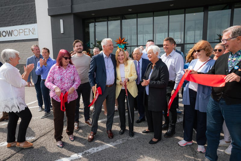 Slumberland Furniture CEO Kenny Larson cut the ribbon in Sunset Hills.