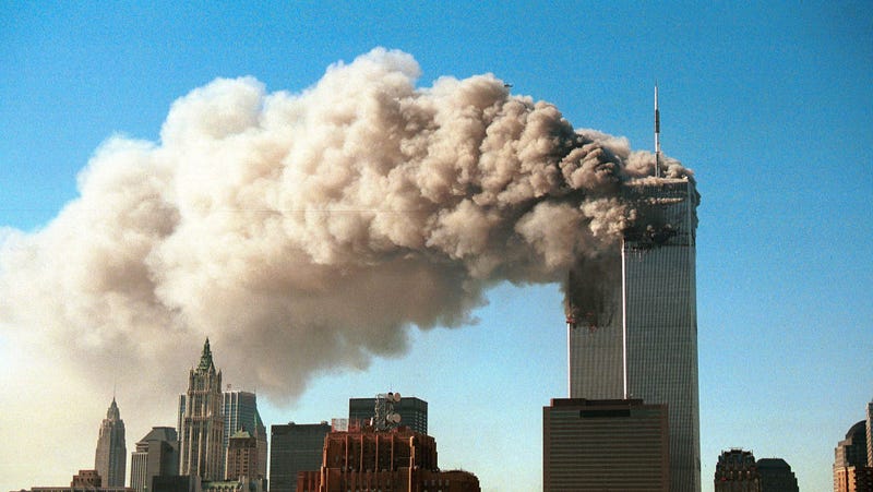 Smoke pours from the twin towers of the World Trade Center as they burn on the morning of September 11, 2001